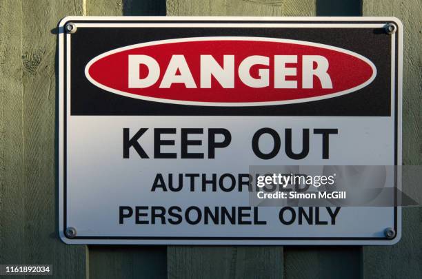 'danger: keep out. authorised personnel only' warning sign on a fence - keep out sign stock pictures, royalty-free photos & images