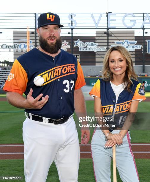 Catcher Cameron Rupp of the Las Vegas Aviators poses with chef Giada De Laurentiis during her celebrity chef appearance at Las Vegas Ballpark on July...