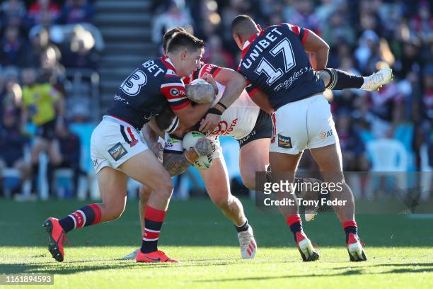 Joshua McGuire of the North Queensland Cowboys is tackled during the round 17 NRL match between the Sydney Roosters and the North Queensland Cowboys...
