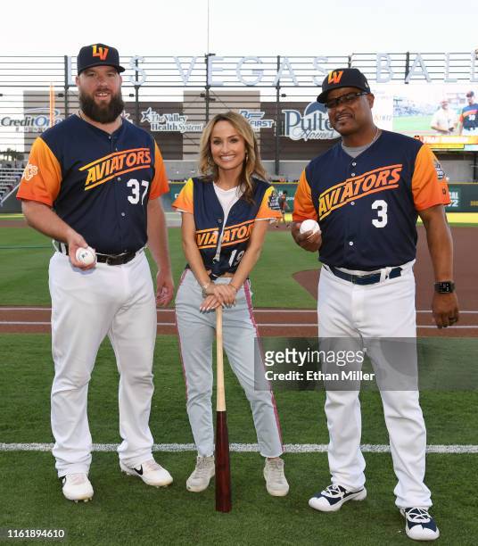 Catcher Cameron Rupp of the Las Vegas Aviators, chef Giada De Laurentiis and hitting coach Eric Martins of the Aviators pose on the field during her...