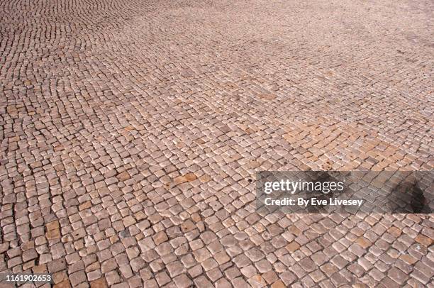 beige cobblestone background - cobblestone sidewalk stock pictures, royalty-free photos & images