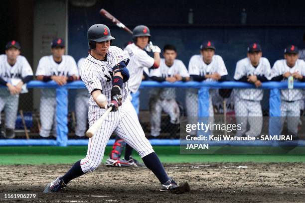 Shota Morishita of SAMURAI JAPAN hits a homer in the bottom half of the seventh inning during the practice match between Collegiate Japan and...