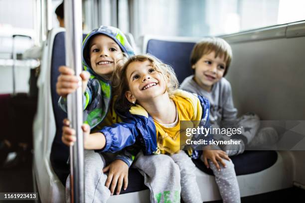 happy little kids enjoying in shuttle bus. - kids fun indonesia stock pictures, royalty-free photos & images