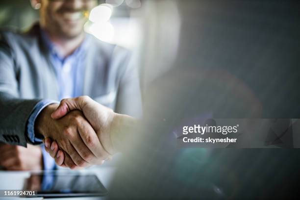 close up of businessmen came to an agreement in the office. - business agreement stock pictures, royalty-free photos & images