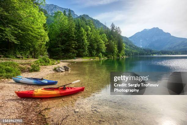 canoe in mountain lake, summer landscape - canoa fotografías e imágenes de stock