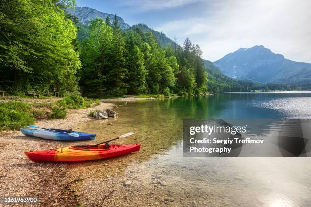 canoe in mountain lake, summer landscape - canoe stock pictures, royalty-free photos & images