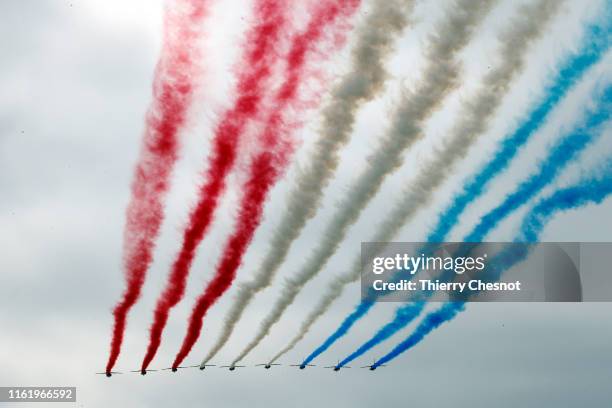 Alpha Jet from the French Air Force "Patrouille de France" fly the traditional Bastille Day military parade on the Champs-Elysees avenue Avenue on...