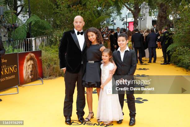 Vin Diesel and and his children, Hania Riley Sinclair, Vincent Sinclair and Pauline Sinclair attend the European Premiere of "The Lion King" at Odeon...