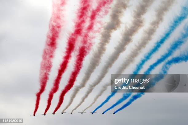 Alpha Jet from the French Air Force "Patrouille de France" fly the traditional Bastille Day military parade on the Champs-Elysees avenue Avenue on...