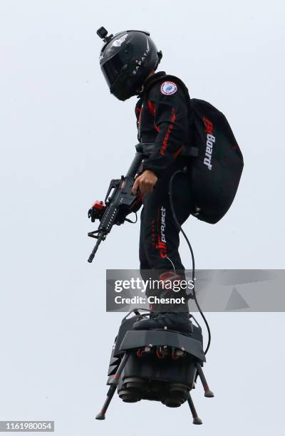 Zapata CEO Franky Zapata flies a jet-powered hoverboard or "Flyboard" during the traditional Bastille Day military parade on the Champs-Elysees...