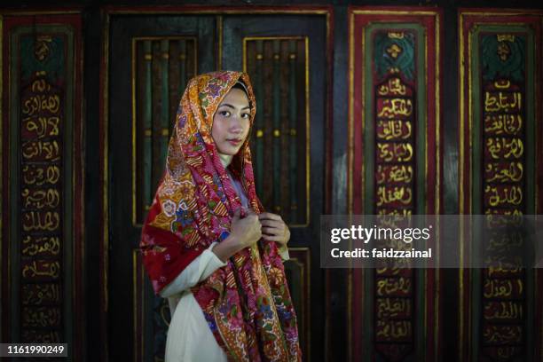 a malay woman - malaysia batik stock pictures, royalty-free photos & images