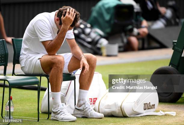 Roger Federer of Switzerland reacts following defeat in his Men's Singles final against Novak Djokovic of Serbia during Day thirteen of The...