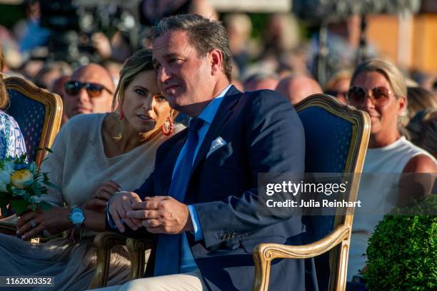 Princess Madeleine of Sweden speaks to her husband, Chris O'Neill during The Crown Princess Victoria of Sweden's 42nd birthday celebrations on July...