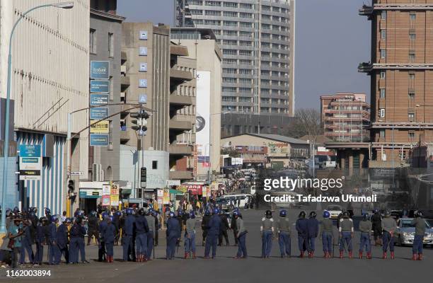 Police barricade a street prior to the protest on August 16, 2019 in Harare, Zimbabwe. The country's main opposition party, Movement for Democratic...
