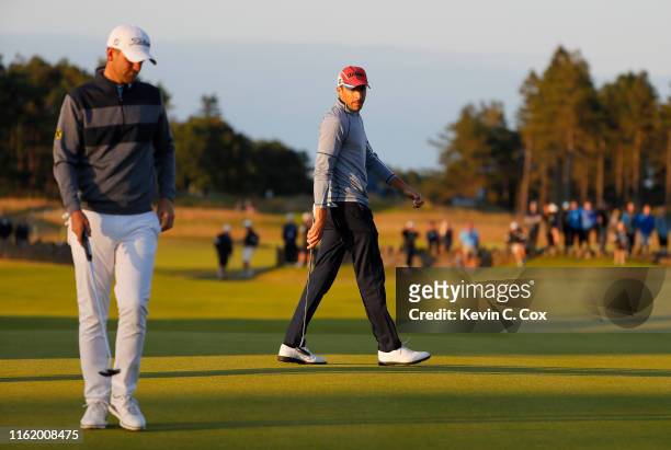 Benjamin Hebert of France and Bernd Wiesberger of Austria line up their putts on the second playoff hole during the final round of the Aberdeen...
