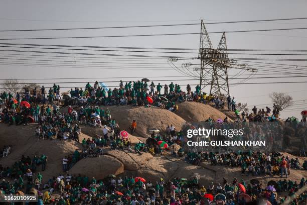 People gather on Wonderkop in Marikana, Rustenburg, where striking mineworkers were killed during the Marikana Massacre, to mark the event's seventh...