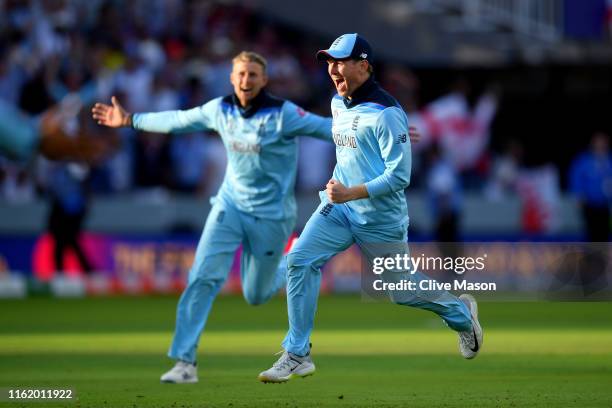 Eoin Morgan and Joe Root of England celebrate victory during the Final of the ICC Cricket World Cup 2019 between New Zealand and England at Lord's...