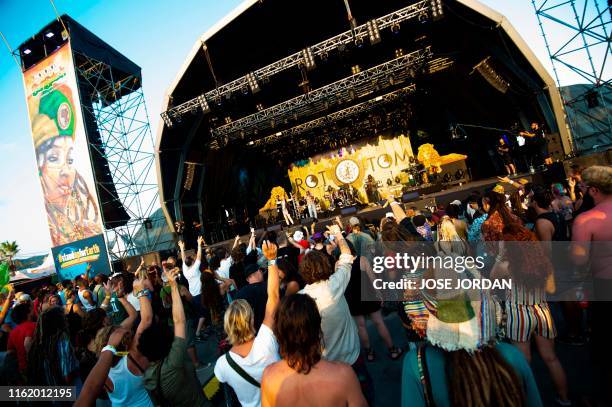 Festival-goers dance during a concert by the Jamaican band The Abyssinians on the first day of the Rototom Sunsplash European Reggae Festival in...