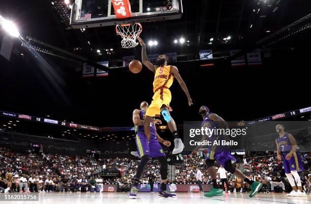 Leslie of Bivouac dunks against Rashard Lewis of 3 Headed Monsters during week four of the BIG3 three-on-three basketball league at Barclays Center...