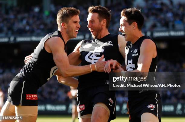 Marc Murphy, Dale Thomas and Zac Fisher of the Blues celebrate during the 2019 AFL round 22 match between the Carlton Blues and the St Kilda Saints...