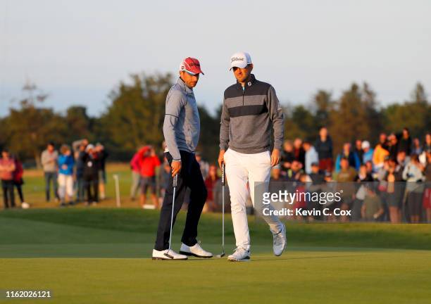Benjamin Hebert of France and Bernd Wiesberger of Austria line up their putts on the third playoff hole during the final round of the Aberdeen...