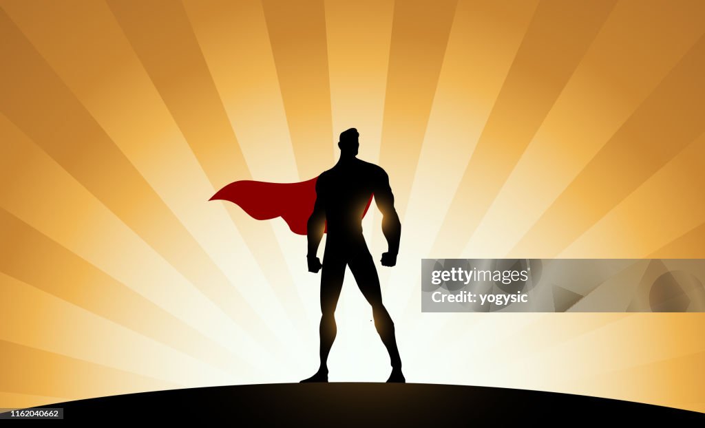 Vector Superhero Silhouette with Sunburst Effect Background