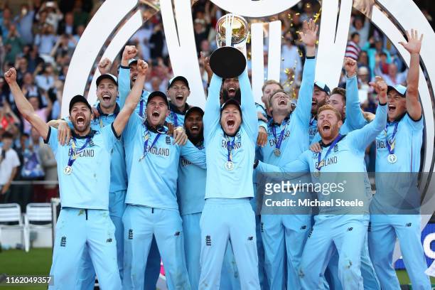 England captain Eoin Morgan lifts the ICC World Cup trophy during the Final of the ICC Cricket World Cup 2019 between New Zealand and England at...