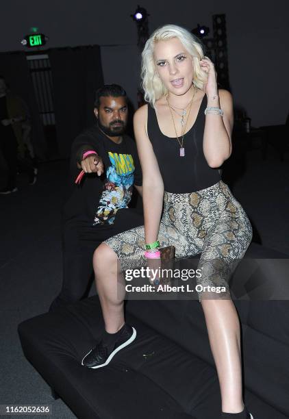 Adrian Dev and Kristi Tucker attend InfoList Pre-Comic-Con Bash at Wisdome Immersive Art Park on July 11, 2019 in Los Angeles, California.