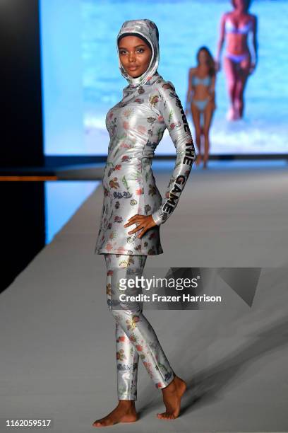 Halima Aden walks the runway during the 2019 Sports Illustrated Swimsuit Runway Show During Miami Swim Week At W South Beach - Runway at WET poolside...