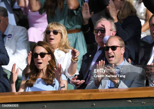 Catherine, Duchess of Cambridge and Prince William, Duke of Cambridge in the Royal Box on Centre court during Men's Finals Day of the Wimbledon...