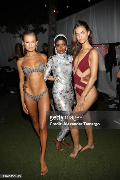 Vita Sidorkina-Morabito, Halima Aden and Robin Holzken attend the 2019 Sports Illustrated Swimsuit Runway Show During Miami Swim Week At W South...