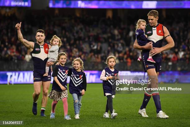 Hayden Ballantyne and Aaron Sandilands of the Dockers thanks the fans on their lap of honour during the 2019 AFL round 22 match between the Fremantle...