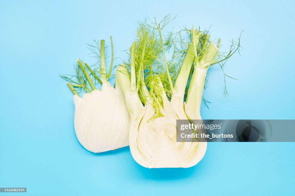 High angle view of sliced fennel on blue background
