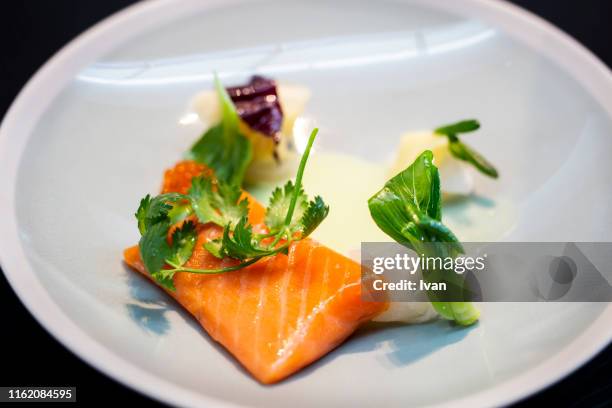 luxury fine dining, fried salmon steak with wild red caviar - red caviar stock pictures, royalty-free photos & images