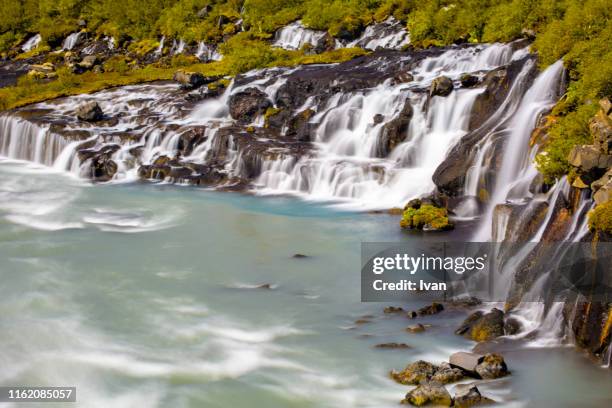hraunfossar and barnafoss waterfall in summer, iceland - hraunfossar stock pictures, royalty-free photos & images
