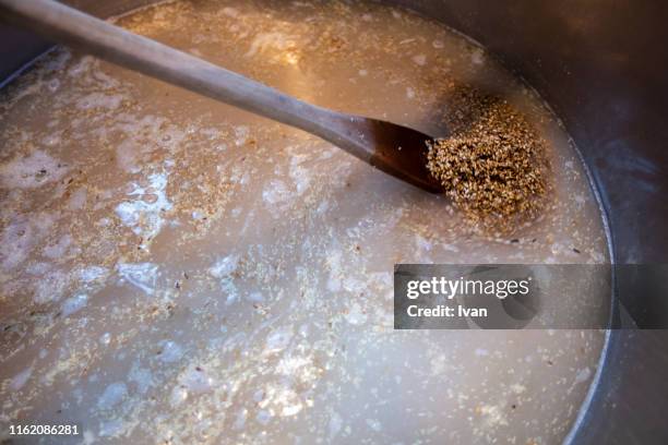 wheat fermentation, barely in a tank to product beer or whisky - levadura fotografías e imágenes de stock