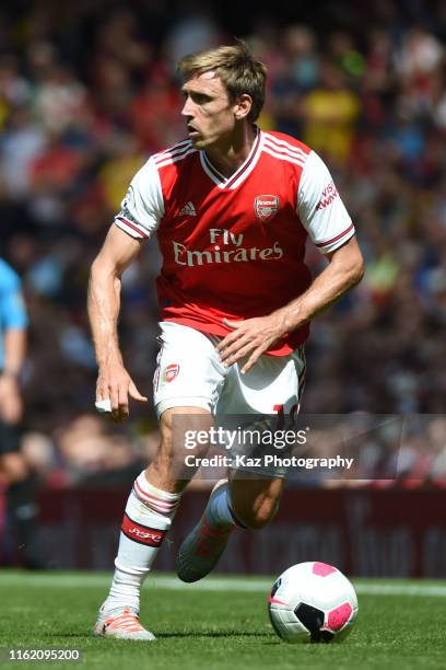 Nacho Monreal of Arsenla keeps the ball during the Premier League match between Arsenal FC and Burnley FC at Emirates Stadium on August 17, 2019 in...