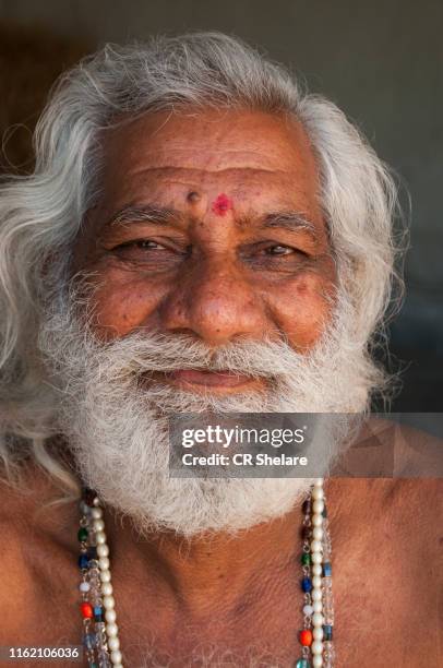 sadhu or pilgrims near temple, rameswaram, india. - pamban rameswaram photos et images de collection