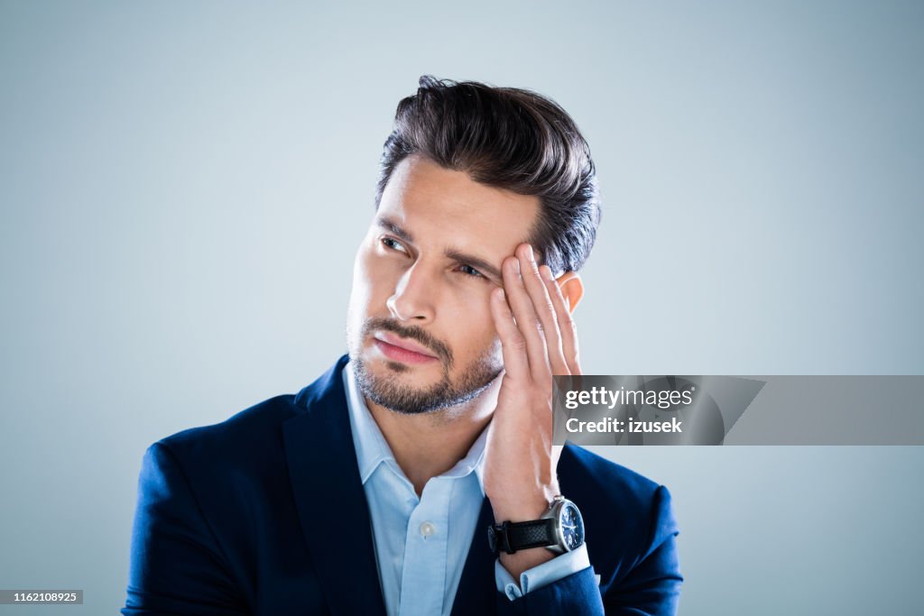 Pensive young businessman