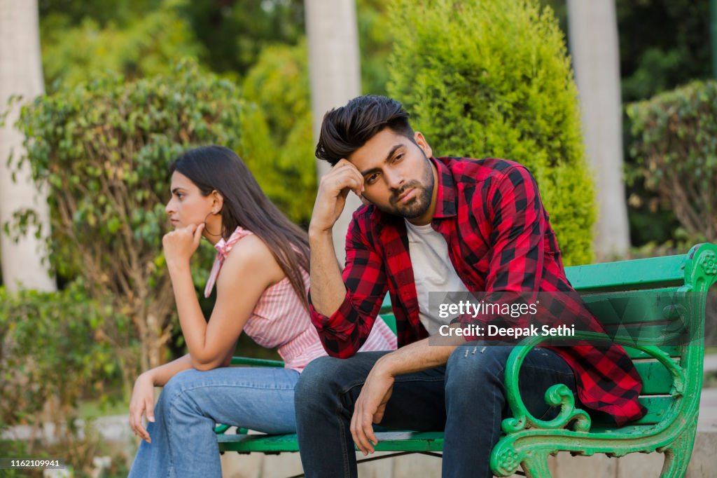 Young couple in public park - stock photo