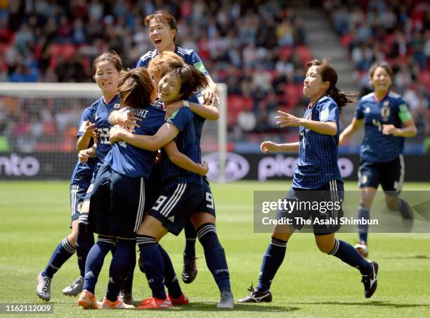 Mana Iwabuchi of Japan celebrates scoring the opening goal with her team mates during the 2019 FIFA Women's World Cup France group D match between...