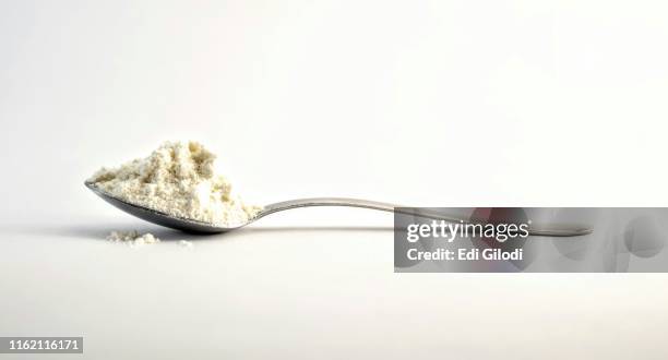 little spoon of flour - flour dust stock pictures, royalty-free photos & images