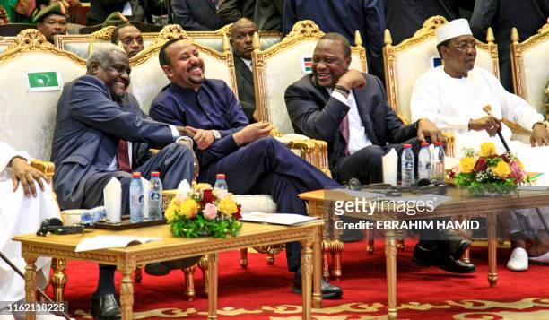 Chairperson of the African Union Commission Moussa Faki Mahamat, Ethiopian Prime Minister Abiy Ahmed, Kenyan President Uhuru Kenyatta, and Chadian...