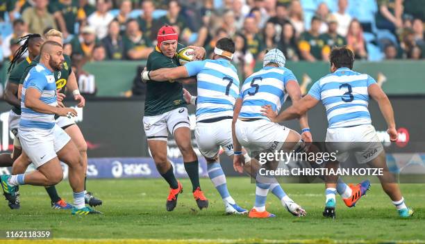 South Africa Captain and hooker Schalk Brits is tackled by Argentina flanker Marcos Kremer during their 2019 Rugby Union World Cup warm-up test match...