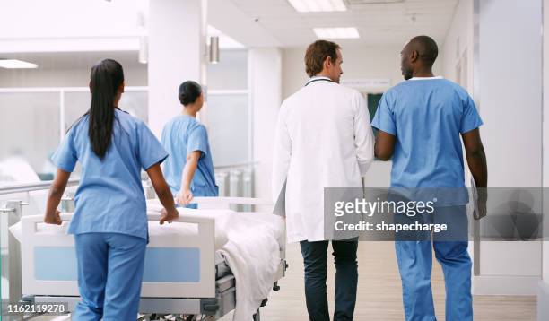 ready to take their patient into theatre - press screening stock pictures, royalty-free photos & images