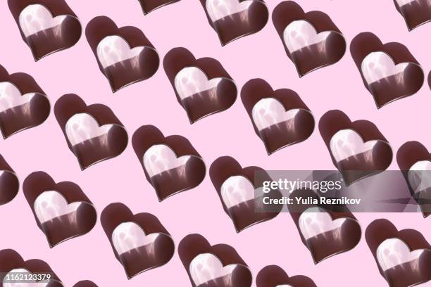 repeated heart shapes on pink background - pastry cutter bildbanksfoton och bilder