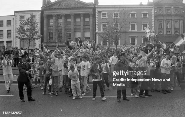 Irish Football fans celebrating on O'Connell Street along with a few Norwegian fans, . .