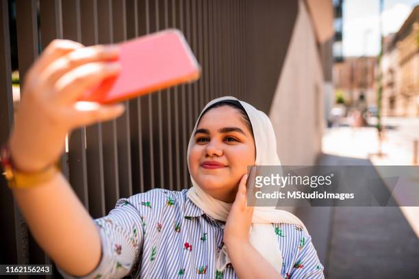 selfie time - chubby arab stock pictures, royalty-free photos & images