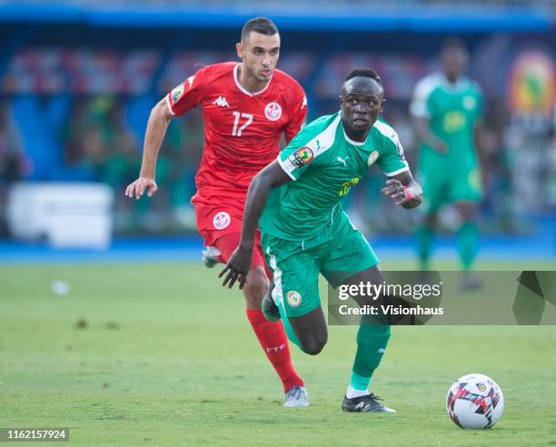Sadio Mané of Senegal and Ellyes Joris Skhiri of Tunisia during the 2019 Africa Cup of Nations Semi Final match between Senegal and Tunisia at 30th...