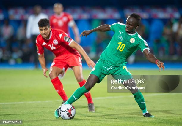 Sadio Mané of Senegal and Drager Mohamed of Tunisia during the 2019 Africa Cup of Nations Semi Final match between Senegal and Tunisia at 30th June...
